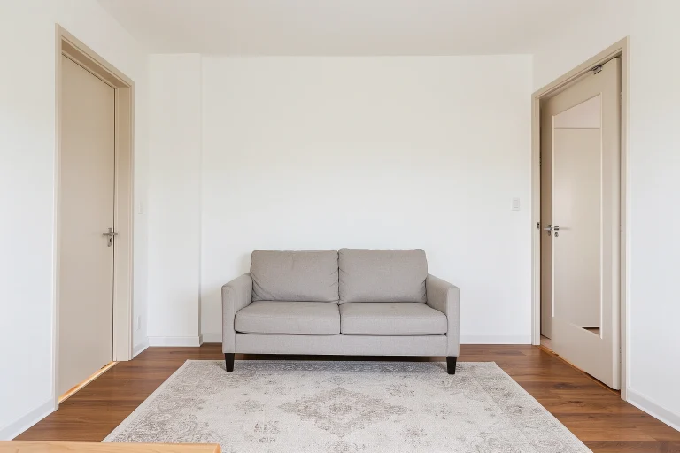 Small living room layout with two doors and clear walkway